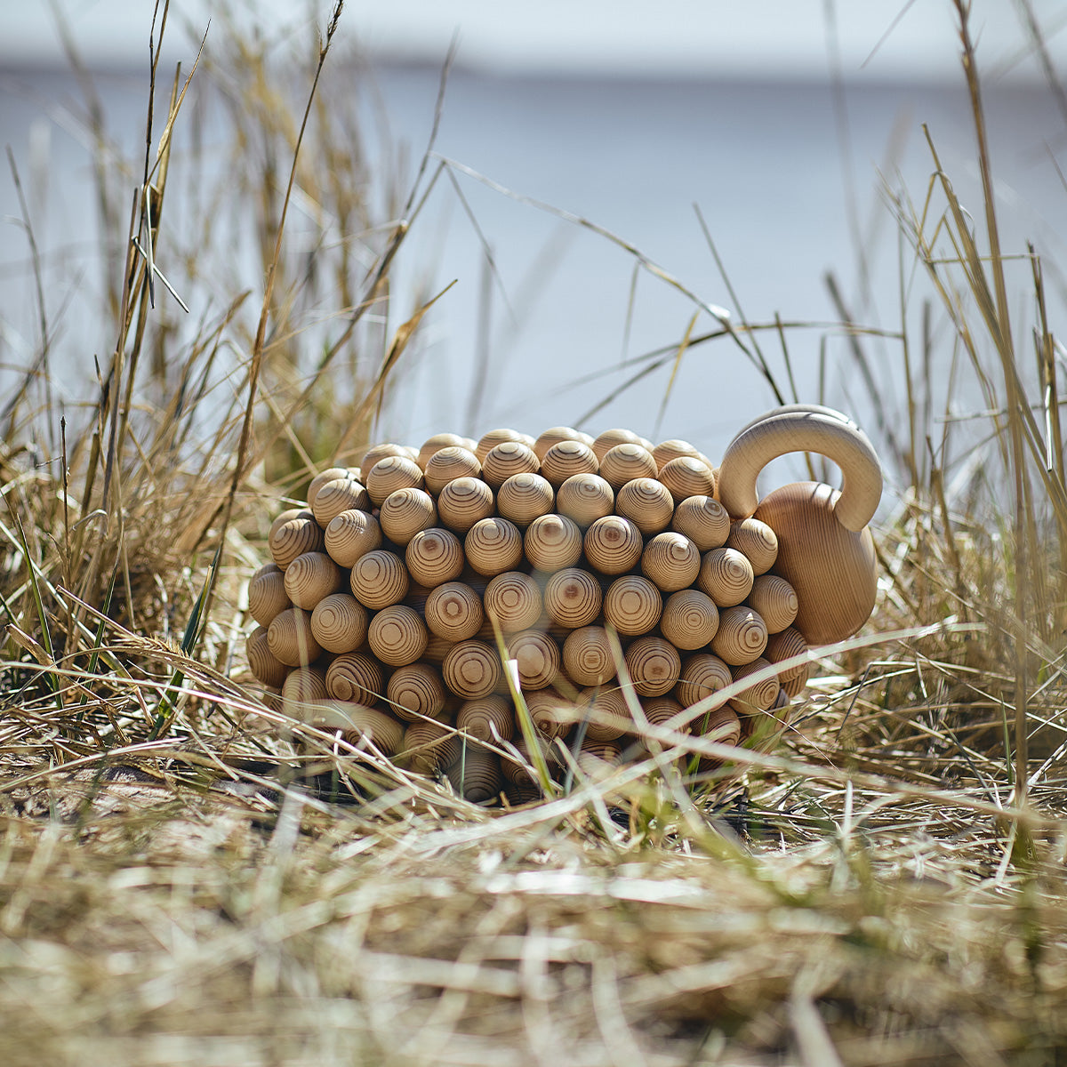 Pässi figurine, varnished wood
