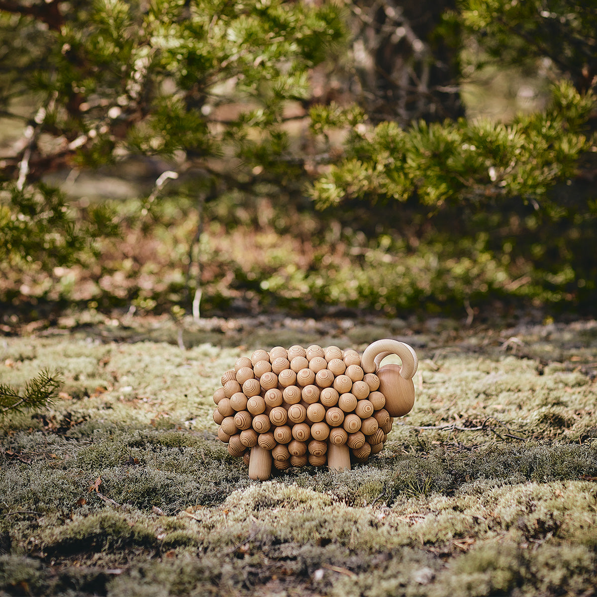 Pässi figurine, varnished wood