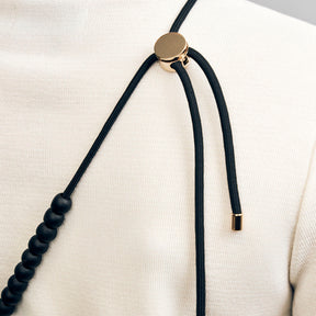 Naomi phone strap, black and gold
