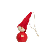 Red elf figurine with a heart on a white background