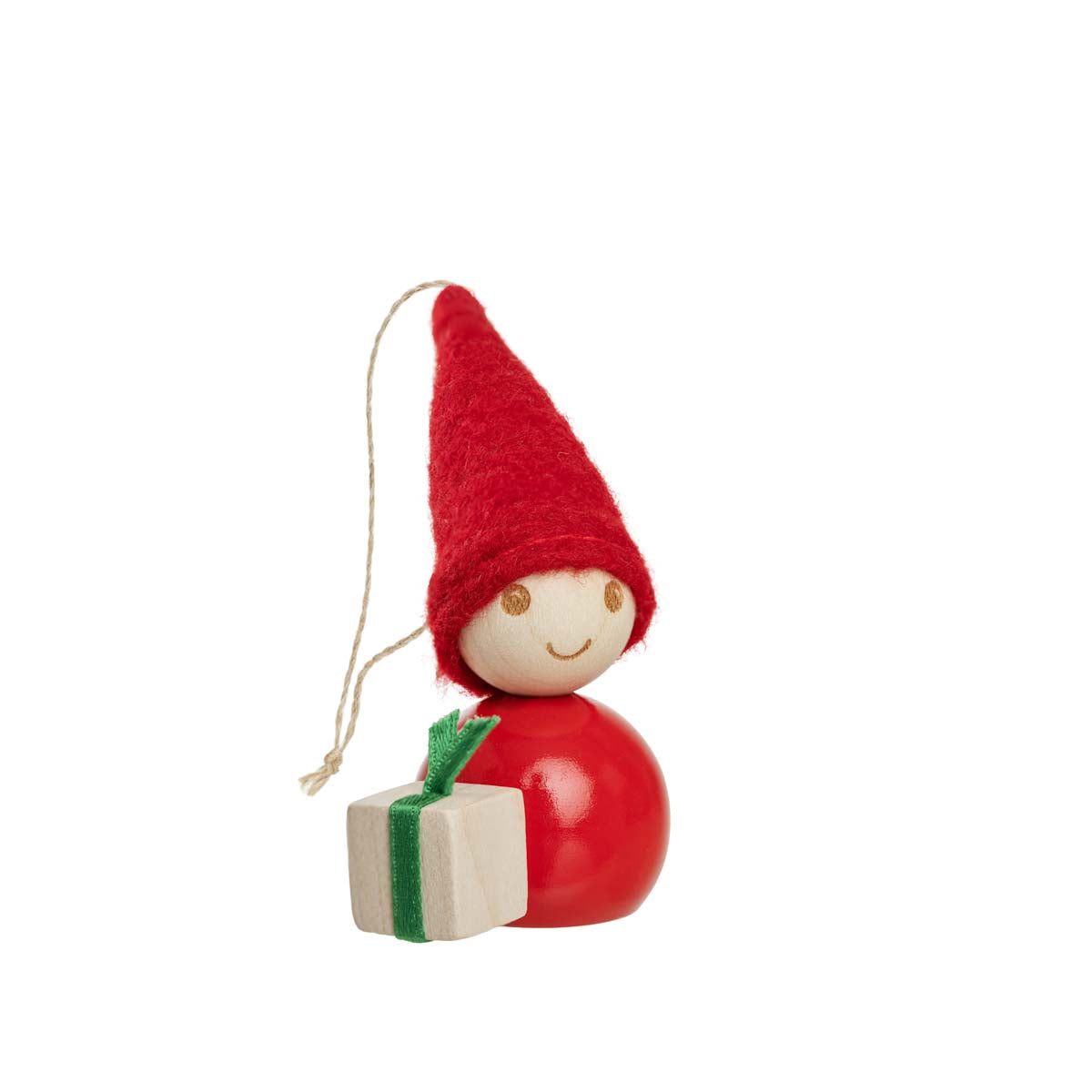A small wooden elf Christmas ornament with a red felt hat, a red wooden body, a smiling face, and a small wrapped gift in front, shown on a plain white background.