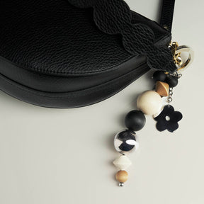 Lemmikki bag charm, varnished wood