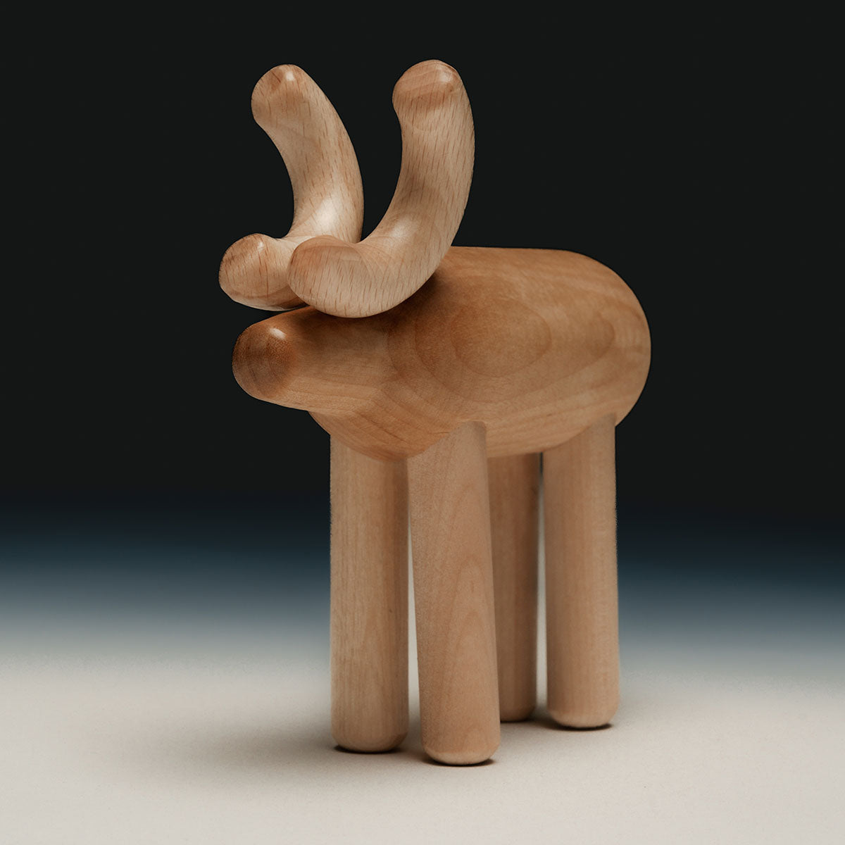 Reindeer sculpture, varnished wood