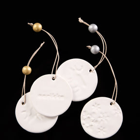 Poro ornament, ceramic, white and gold